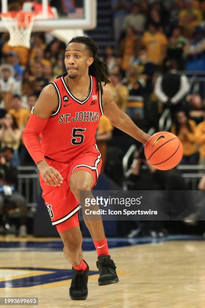 St. John's Red Storm guard Daniss Jenkins brings the ball up court during a game between the Marquette Golden Eagles and the St. Johns Red Storm at...