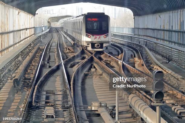 Subway train is running on Line 5 in Beijing, China, on February 6, 2024.