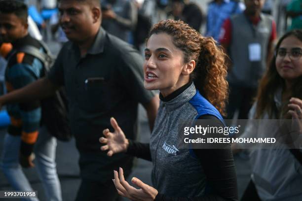 Bollywood actress Taapsee Pannu arrives to participate in the Plankathon 2024, an attempt to break the 'Guinness World Record' for the most people...