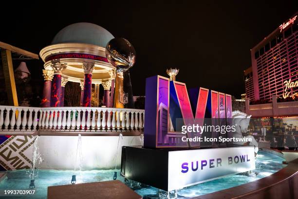 Sign of the Super Bowl LVIII logo on display in the fountains at Caesars Palace Hotel & Casino with a replica of the Vince Lombardi Trophy leading up...