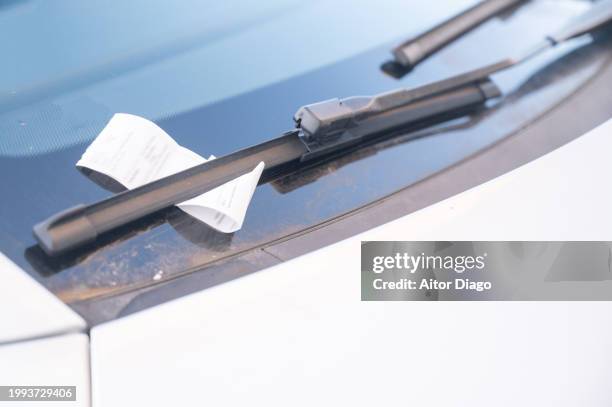 fine on a car windshield. berlin. germany. - penalty fee stock pictures, royalty-free photos & images