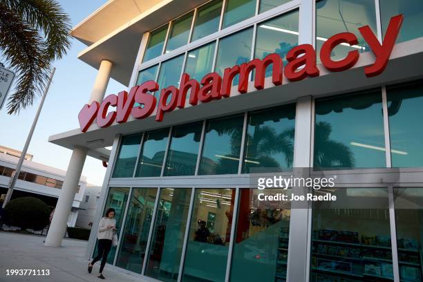 Sign outside of a CVS pharmacy store on February 07, 2024 in Miami, Florida. The company lowered its 2024 adjusted earnings forecast to at least...