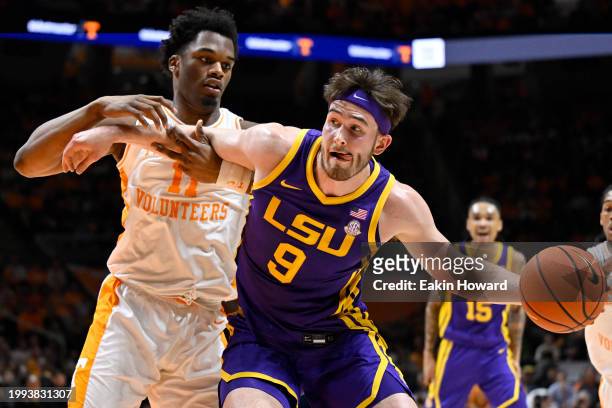 Will Baker of the LSU Tigers drives to the basket against Tobe Awaka of the Tennessee Volunteers in the first half at Thompson-Boling Arena on...