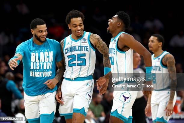 Brandon Miller of the Charlotte Hornets reacts following a basket during the first half of the game against the Toronto Raptors at Spectrum Center on...