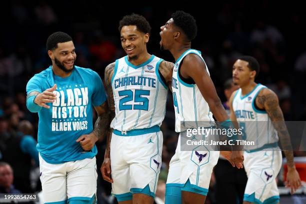 Brandon Miller of the Charlotte Hornets reacts following a basket during the first half of the game against the Toronto Raptors at Spectrum Center on...