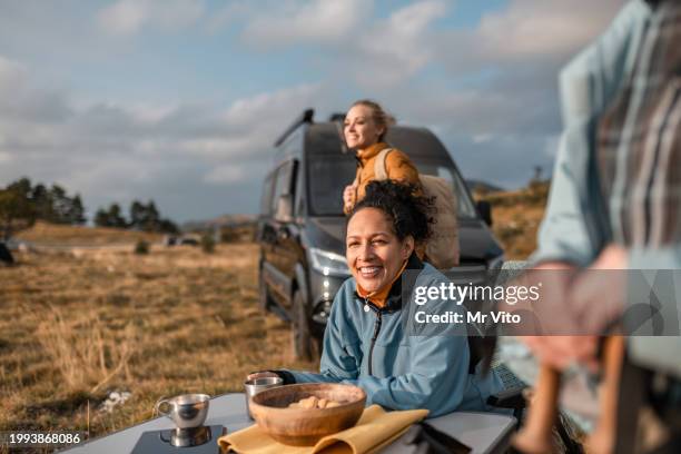 meeting of hikers next to the camper - freedom stock pictures, royalty-free photos & images