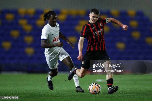 Ollie Morgan of AFC Bournemouth passes the ball whilst under pressure from Damola Ajayi of Tottenham Hotspur during the FA Youth Cup fifth-round...