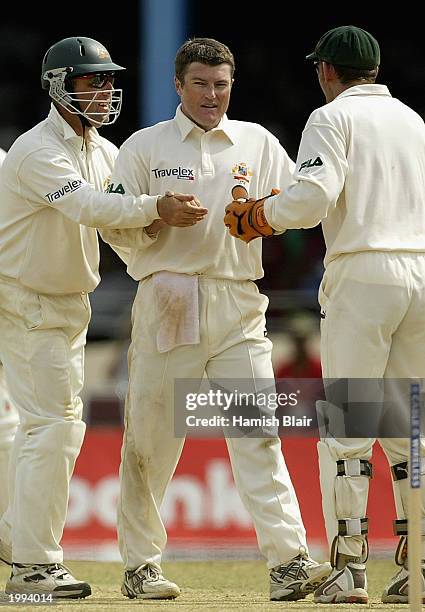 Stuart MacGill of Australia celebrates his 100th Test wicket that of Carlton Baugh of the West Indies during day three of the Second Test between the...