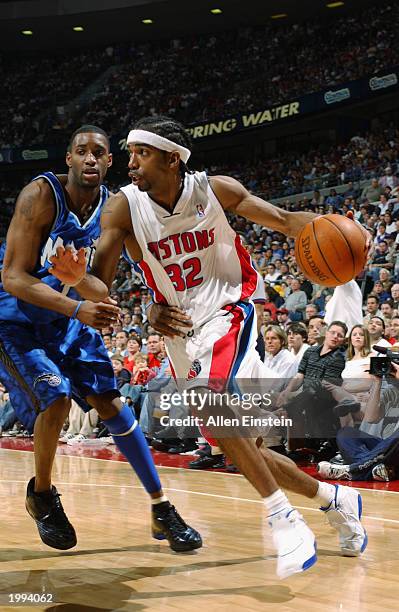 Richard Hamilton of the Detroit Pistons drives baseline around Tracy McGrady of the Orlando Magic in Game seven of the Eastern Conference...