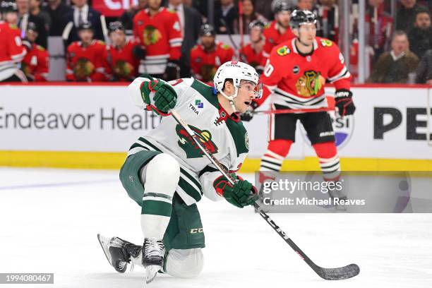 Jacob Lucchini of the Minnesota Wild scores a goal past Petr Mrazek of the Chicago Blackhawks during the first period at the United Center on...