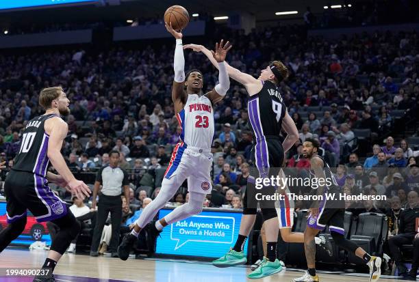 Jaden Ivey of the Detroit Pistons shoots the ball against Kevin Huerter of the Sacramento Kings in the first quarter at Golden 1 Center on February...