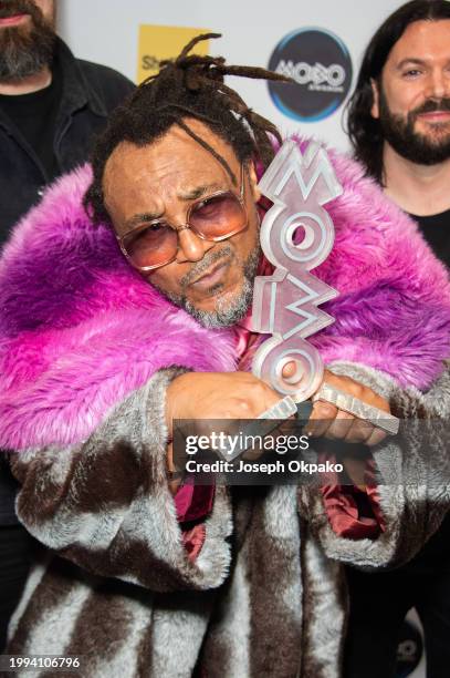 Benji Webbe of Skindred pose with the Best Alternative Music Act award in the winners room during the MOBO Awards 2024 at Utilita Arena Sheffield on...