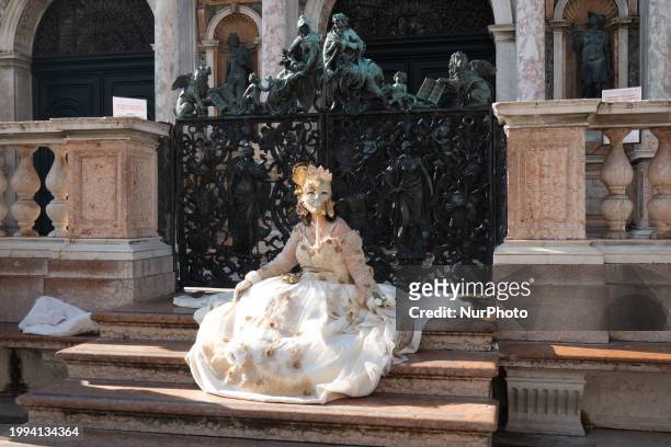 Woman wearing typical Venice Carnival costumes and masks is seen in San Marco square in Venice, Italy, on February 2nd, 2024. The Carnival of Venice...