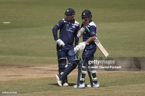 Tom Rogers of Victoria and Nic Maddinson of Victoria chat between overs during the Marsh One Day Cup match between Victoria and South Australia at...