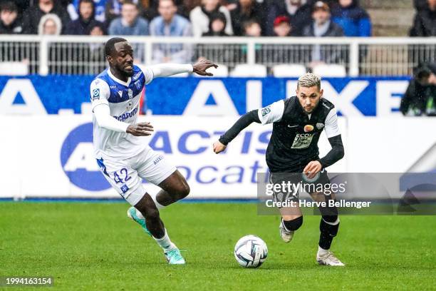 Farid EL MELALI of SCO Angers Elisha OWUSU of AJ Auxerre during the Ligue 2 BKT match between Association de la Jeunesse Auxerroise and Angers...