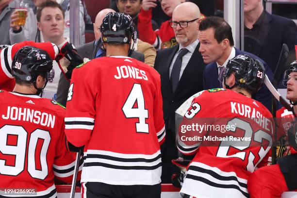 Head coach Luke Richardson of the Chicago Blackhawks huddles with the team against the Minnesota Wild during the third period at the United Center on...