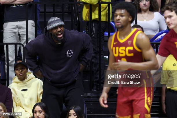 LeBron James of the Los Angeles Lakers shouts to his son, Bronny James of the USC Trojans, during Bronny's game against the California Golden Bears...