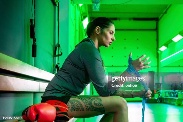 boxing woman preparing herself - sport determination stock pictures, royalty-free photos & images