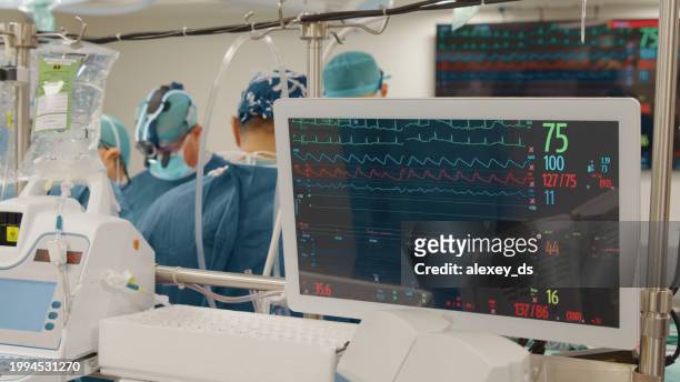 monitoring vitality in an operating room during the heart surgery - heart bypass stock pictures, royalty-free photos & images