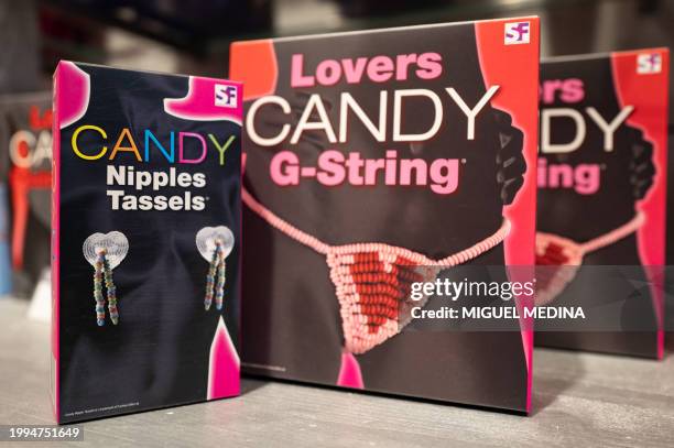 This photograph taken in Paris, on February 9 shows gift bags of candy nipple tassels and candy G-Strings displayed at the "Passage du Desir" love...