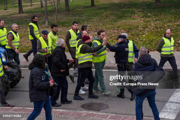 National Police officers with farmers and ranchers during the third day of tractor protests to demand improvements in the sector, February 8 in...