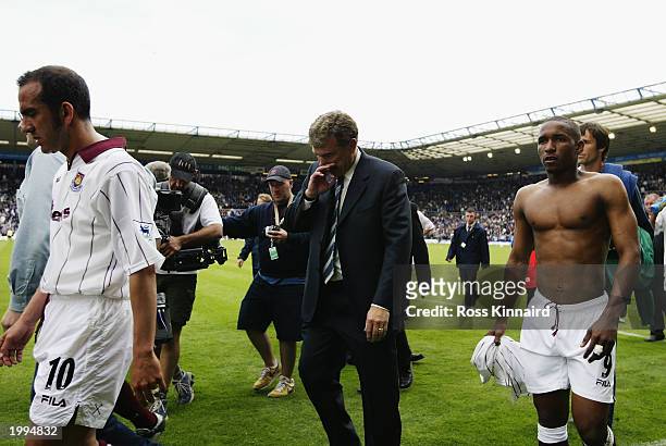 Paulo Di Canio, Trevor Brooking and Jermaine Defoe of West Ham United look dejected as they walk off at the end of the FA Barclaycard Premiership...