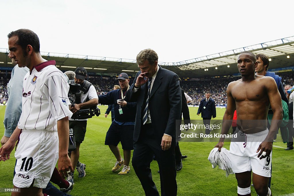 Paulo Di Canio, Trevor Brooking and Jermaine Defoe of West Ham United look dejected as they walk off
