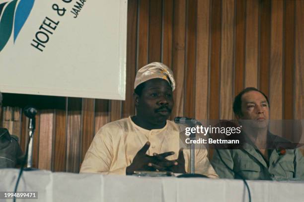 Nigerian President Olusegun Obasanjo speaking at a press conference in Runaway Bay, Jamaica, December 29th 1978. At right is Canadian Prime Minister...