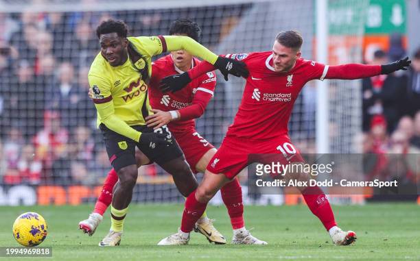 Burnley's David Datro Fofana shields the ball from Liverpool's Wataru Endo and Alexis Mac Allister during the Premier League match between Liverpool...
