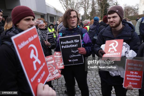 Far-left, pro-Palestinian students hold placards showing the communist hammer and sickle and the slogan "Freedom for Palestine!" as they gather to...