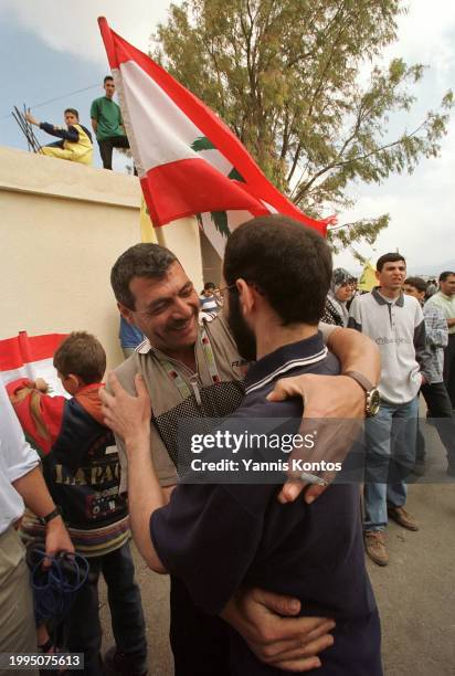 Mazid Mozed and Houssein Assad Akiel, former Lebanese Hezbollah prisoners, embrace each other after being liberated at the Israeli-operated Khiam...