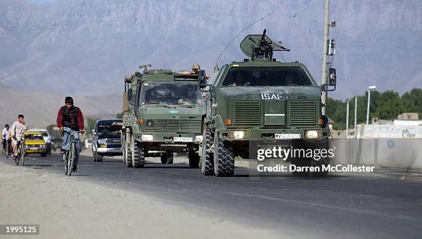 An International Security Assistance Force patrol drives down the Jalalabad Road May 13, 2003 in Kabul, Afghanistan. Two ISAF soldiers were wounded...