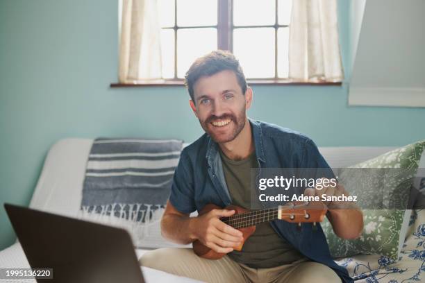 man, portrait and ukulele or laptop for learning instrument or online for tuning sound, performance or school. male person, teacher and virtual education on sofa or live streaming, audio or music - vip room stock pictures, royalty-free photos & images