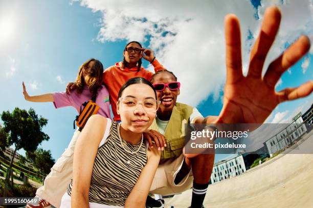 wide angle shot of gen z group of friends hanging out together. - wide angle stock pictures, royalty-free photos & images