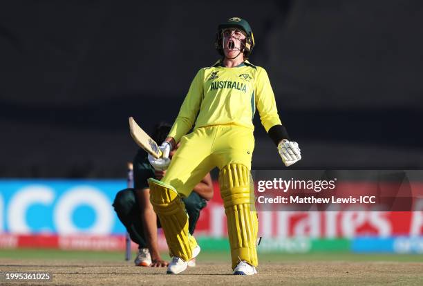 Rafael MacMillan of Australia celebrates as Mohammad Zeeshan of Pakistan cuts a dejected figure following the ICC U19 Men's Cricket World Cup South...