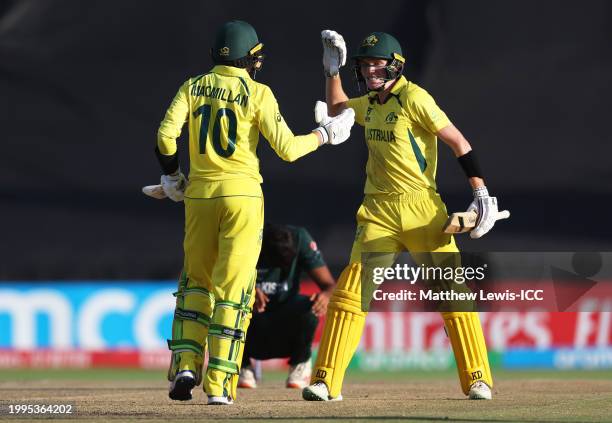 Callum Vidler and Rafael MacMillan of Australia celebrate following the ICC U19 Men's Cricket World Cup South Africa 2024 Semi-Final match between...