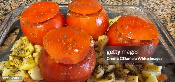preparing stuffed tomatoes - stuffed tomatoes stock pictures, royalty-free photos & images