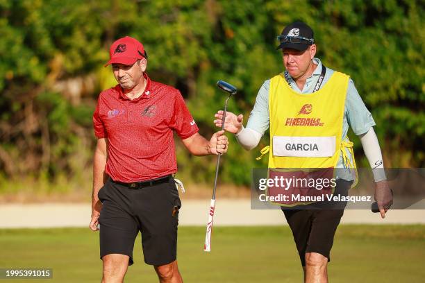 Captain Sergio Garcia of Fireballs GC gives his golf club to his caddy during day three of the LIV Golf Invitational - Mayakoba at El Camaleon at...