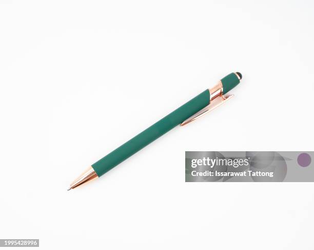 green pen isolated on white background - stylo photos et images de collection