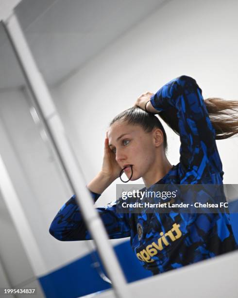 Eve Perisset of Chelsea ties her hair inside the dressing room prior to the FA Women's Continental Tyres League Cup Quarter Final match between...