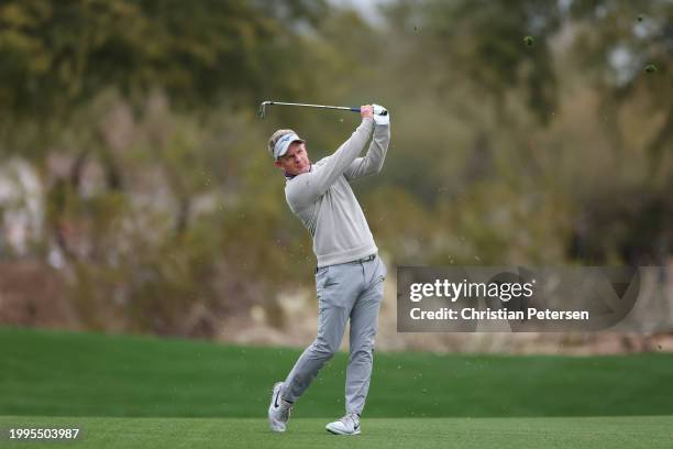 Luke Donald of England plays a second shot on the second hole during the first round of the WM Phoenix Open at TPC Scottsdale on February 08, 2024 in...