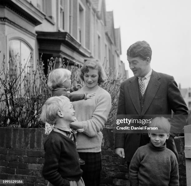 Writer Kingsley Amis with his family including wife Hilary Bardwell , Martin Amis , Philip Amis and Sally Amis outside their house at 24, The Grove,...