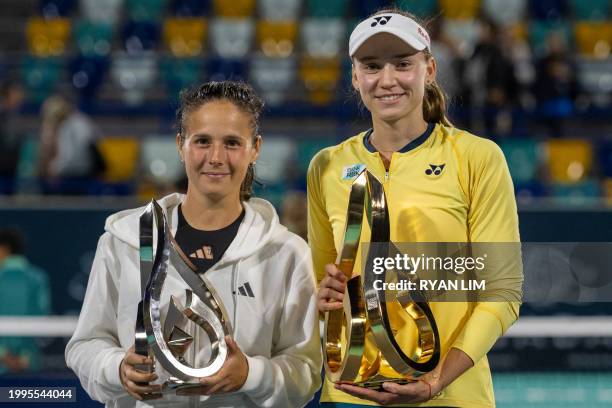 Elena Rybakina of Kazakhstan and Daria Kasatkina of Russia hold their trophies during the podium ceremony after the Women's Singles final match won...