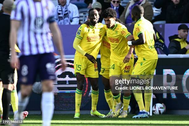 Nantes' Zimbabwean forward Tino Kadawere celebrates with Nantes' French defender Nathan Zeze after scoring his team's second goal during the French...