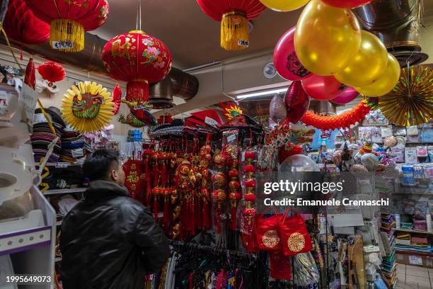 Man shops at a store selling party decorations in the Paolo Sarpi district on February 08, 2024 in Milan, Italy. The Chinese community of Milan - the...