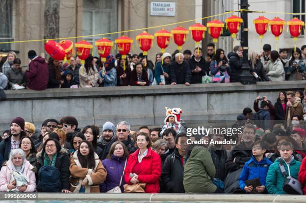 People watch performances in Trafalgar Square as part of the celebrations of Chinese New Year and the arrival of the Year of the Dragon in London,...
