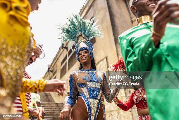 young woman dancing at a street carnival party - rio de janeiro party stock pictures, royalty-free photos & images