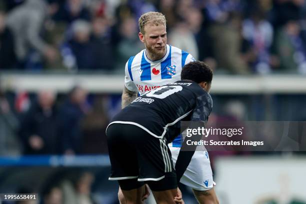 Luuk Brouwers of SC Heerenveen celebrates the victory, Chuba Akpom of Ajax during the Dutch Eredivisie match between SC Heerenveen v Ajax at the Abe...