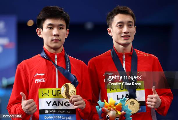 Gold Medalists, Junjie Lian and Hao Yang of Team People's Republic of China pose with their medals during the Medal Ceremony after the Men's...
