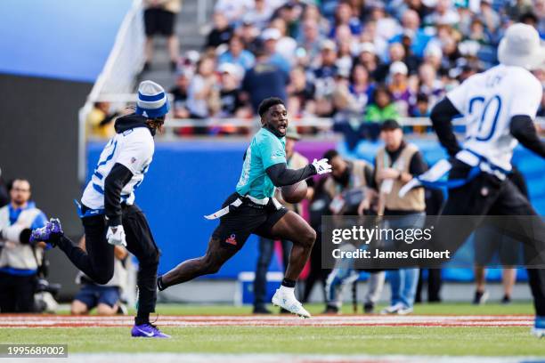 Tyreek Hill of the Miami Dolphins and AFC runs the ball during the 2024 NFL Pro Bowl at Camping World Stadium on February 04, 2024 in Orlando,...